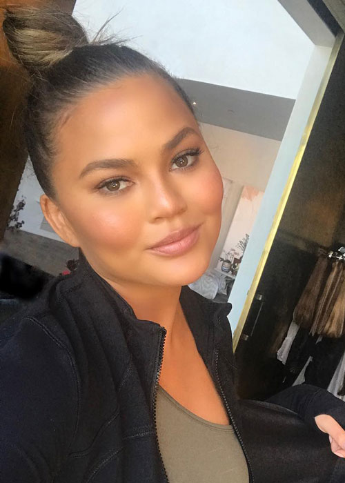 Chrissy Teigen Upped Her Game This Luxe LED Mask | BEAUTY/crew